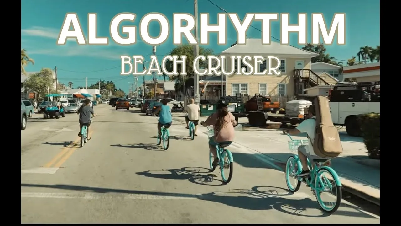 Riders on beach cruiser bicycles in the Algorhythm video for Beach Cruiser